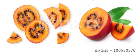 Fresh tamarillo fruit slices with leaves isolated on white background. Top view. Flat lay. Set or collection 100550576