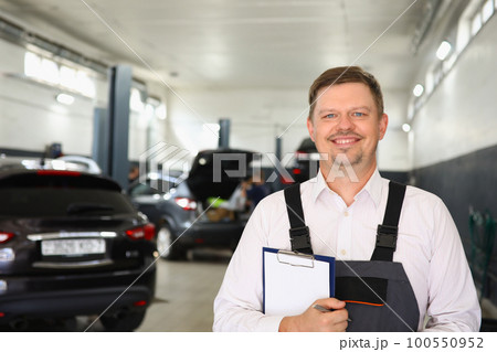 Portrait of confident male mechanic in workshop Portrait of confident male mechanic in workshop 100550952