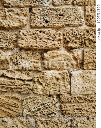 Old natural limestone wall 100551399