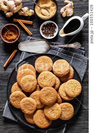 sweet soft ginger cookies on plate, top view 100551426