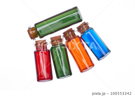 Many filled glass bottles on isolated background Many filled glass bottles on isolated background 100553342