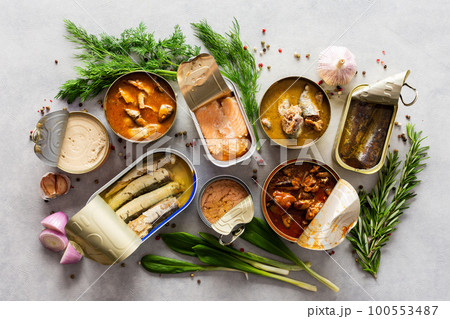 Open tin cans with canned fish 100553487