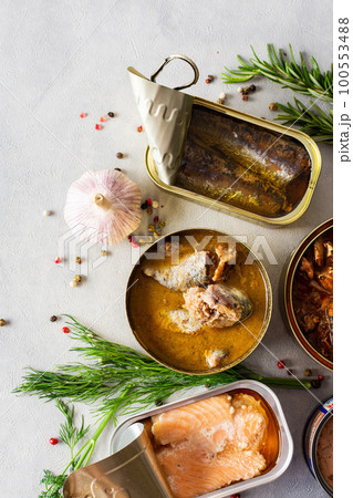 Open tin cans with canned fish 100553488