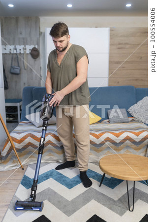 Man husband cleaning the house helping wife 100554006