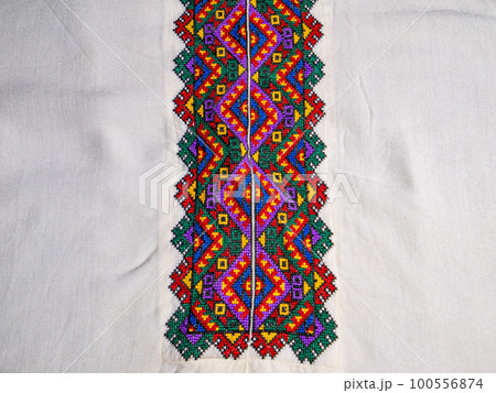 Ukrainian traditional folk embroidery on white fabric. 100556874