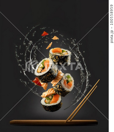 Sushi, rolls and soy sauce levitate over a plate on a black background Sushi, rolls and soy sauce levitate over a plate on a black background 100558959