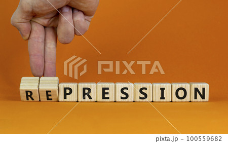 Pression to repression symbol. Businessman turns wooden cubes, changes the word pression to repression. Beautiful orange background. Business, pression to repression concept. Copy space. Pression to repression symbol. Businessman turns wooden cubes, changes the word pression to repression. Beautiful orange background. Business, pression to repression concept. Copy space. 100559682