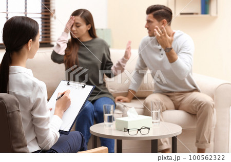 Professional psychologist working with couple in office Professional psychologist working with couple in office 100562322