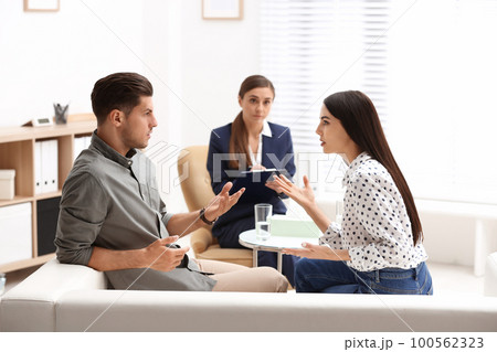 Professional psychologist working with couple in office Professional psychologist working with couple in office 100562323