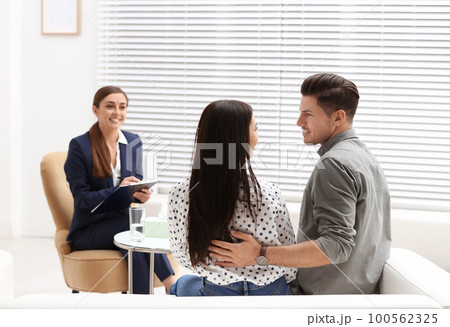 Professional psychologist working with couple in office 100562325