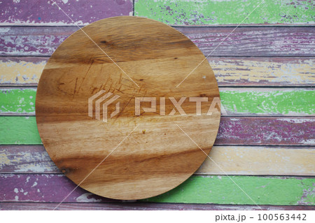 wooden chopping board on black background top down  100563442