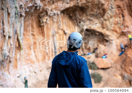 Man is climbing, hiking in the mountains. Man is climbing, hiking in the mountains. 100564094