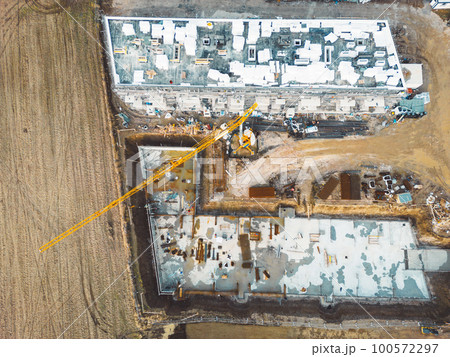 Top down view construction site of two residential buildings in progress Top down view construction site of two residential buildings in progress 100572297