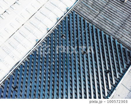 Unrecognizable industrial area with a field of solar panels  100572303
