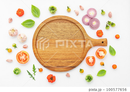 The ingredients for homemade pizza set up on white concrete background. 100577656