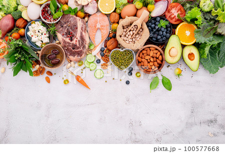Ketogenic low carbs diet concept. Ingredients for healthy foods selection set up on white concrete background. Ketogenic low carbs diet concept. Ingredients for healthy foods selection set up on white concrete background. 100577668