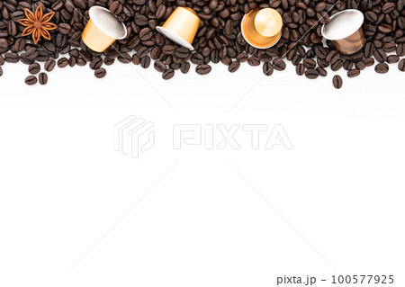 Dark roasted coffee beans setup on white background with copy space. 100577925