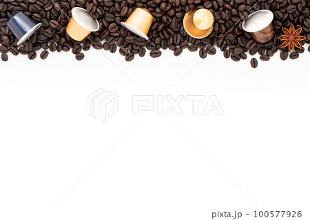Dark roasted coffee beans setup on white background with copy space. 100577926