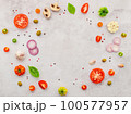 The ingredients for homemade pizza set up on white concrete background. 100577957