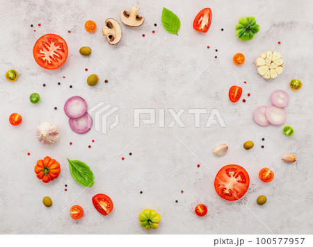 The ingredients for homemade pizza set up on white concrete background. The ingredients for homemade pizza set up on white concrete background. 100577957