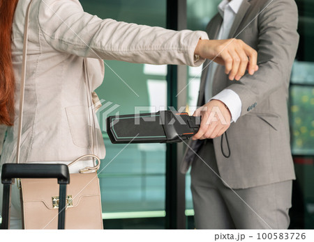 Airport security male check at gates with metal detector and scanner 100583726