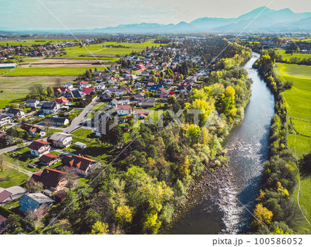 River running trough the suburb community aerial view River running trough the suburb community aerial view 100586052