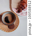 black coffee, cookies and croissant 100588912