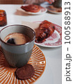 black coffee, cookies and croissant 100588913