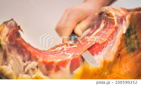 Dry-cured spanish ham Jamon. Close-up view. 100590352
