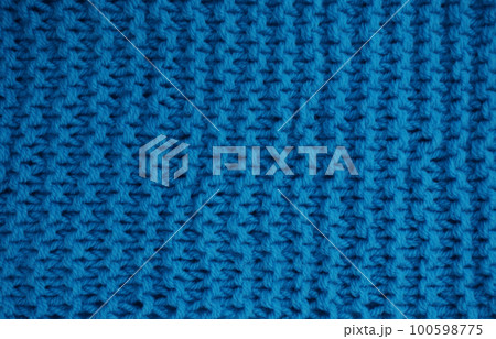 Hit natural texture of knitted wool textile material background. Hit natural texture of knitted wool textile material background. 100598775