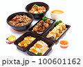 Set of Japanese food, pork rice, salmon pickle, salmon sushi rolls, and takoyaki or squid balls on white background. 100601162