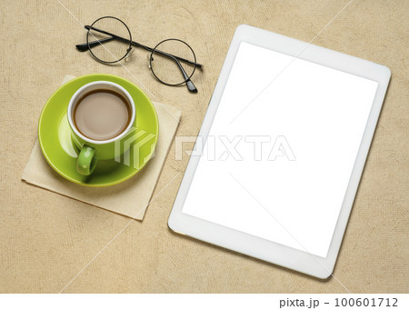 mockup of digital tablet with a blank isolated screen (clipping path included) with a cup of coffee and glasses mockup of digital tablet with a blank isolated screen (clipping path included) with a cup of coffee and glasses 100601712
