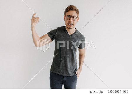 Angry and mad gangster with color hair and eyeglasses in black t-shirt. 100604463