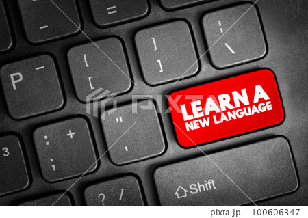 Learn A New Language text button on keyboard, concept background 100606347