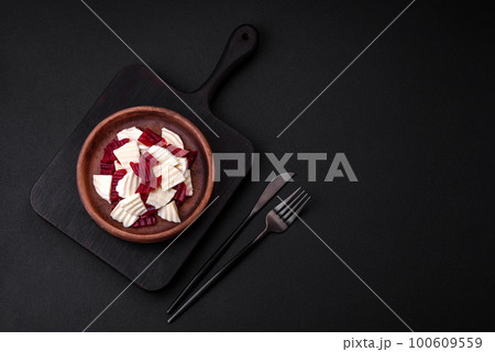 Delicious fresh mozzarella and boiled beets cut into slices 100609559