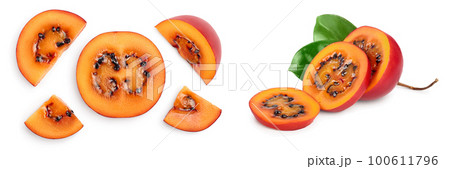 Fresh tamarillo fruit slices with leaves isolated on white background. Top view. Flat lay. Set or collection 100611796
