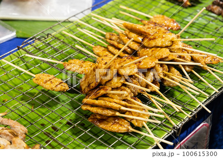 Moo Ping or Pork satay, is popular street food in Thailand. Moo Ping or Pork satay, is popular street food in Thailand. 100615300