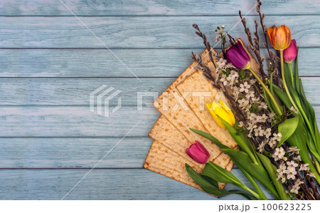Passover matzoh jewish holiday bread over wooden table. 100623225