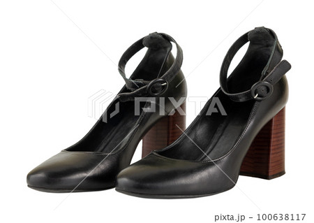 Black leather high brown heels female shoes isolated on white background. Black leather high brown heels female shoes isolated on white background. 100638117