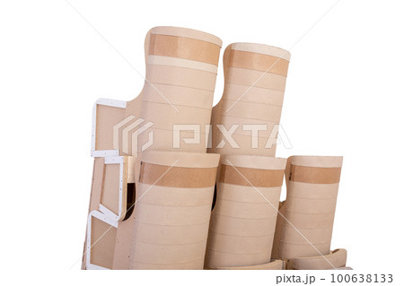 A stack of chair bodies on a trolley is prepared for moving to the upholstery shop. 100638133