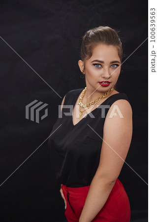 portrait shot of a young Ukrainian woman on the background, after make-up and hairstyle, for clothing advertising portrait shot of a young Ukrainian woman on the background, after make-up and hairstyle, for clothing advertising 100639563