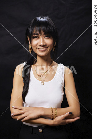 portrait shot of young happy asian or vietnamese woman, enjoying lifestyle, joy, happiness, photo on black background. 100640684