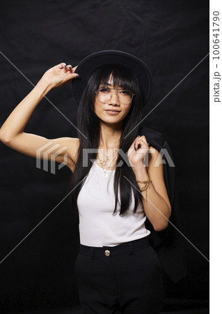 portrait shot of young happy asian or vietnamese woman, enjoying lifestyle, joy, happiness, photo on black background. portrait shot of young happy asian or vietnamese woman, enjoying lifestyle, joy, happiness, photo on black background. 100641790