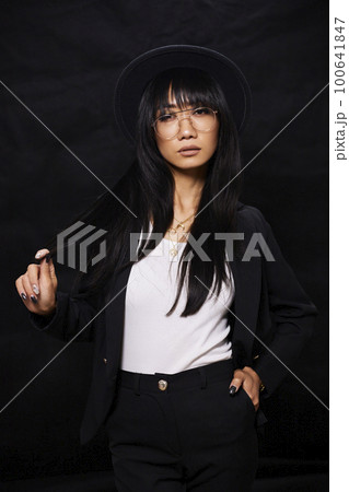portrait shot of young happy asian or vietnamese woman, enjoying lifestyle, joy, happiness, photo on black background. portrait shot of young happy asian or vietnamese woman, enjoying lifestyle, joy, happiness, photo on black background. 100641847