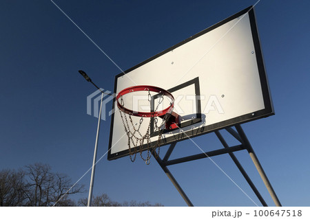 Basketball Court in the summer sunset Basketball Court in the summer sunset 100647518