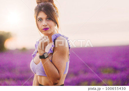 Lavender floral aromatic spring fragance. Hipanic mid woman in nature meadow aromatherapy health Lavender floral aromatic spring fragance. Hipanic mid woman in nature meadow aromatherapy health 100655430