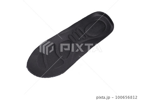 Black orthopedic insole on a white background 100656812