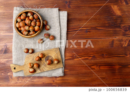 Hazelnuts on a wooden background, the top view copy space. Hazelnuts on a wooden background, the top view copy space. 100656839