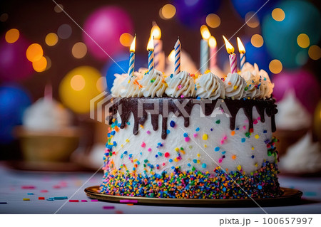 Colorful birthday cake with burning candles, sprinkles and icing. Dessert for celebration. Created with Generative AI 100657997