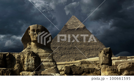 Pyramid and sphinx and storm clouds Pyramid and sphinx and storm clouds 100661595